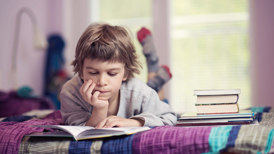   Student reading in bedroom